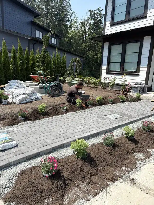 Paver walkway between planting beds, a surface that benefits from careful anti-icing in Chilliwack freeze-thaw weather