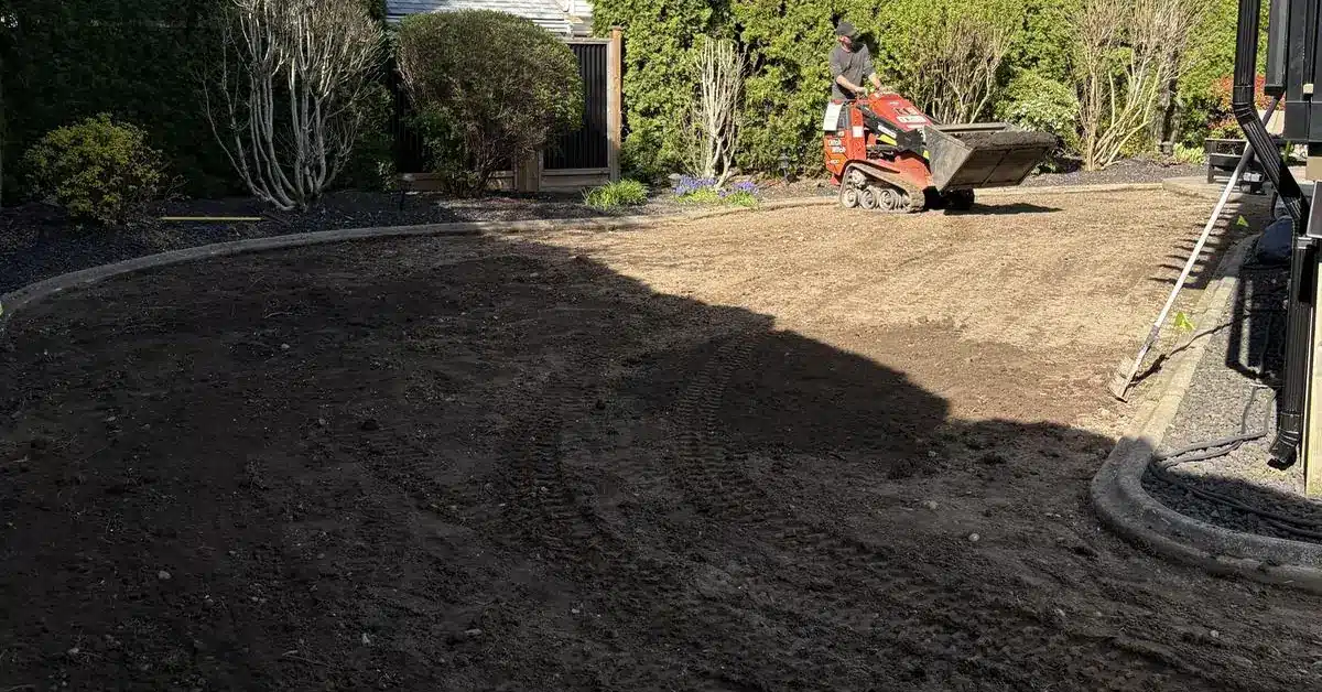 Freshly graded bare soil in a backyard before new lawn, the stage where French drain Chilliwack decisions get made