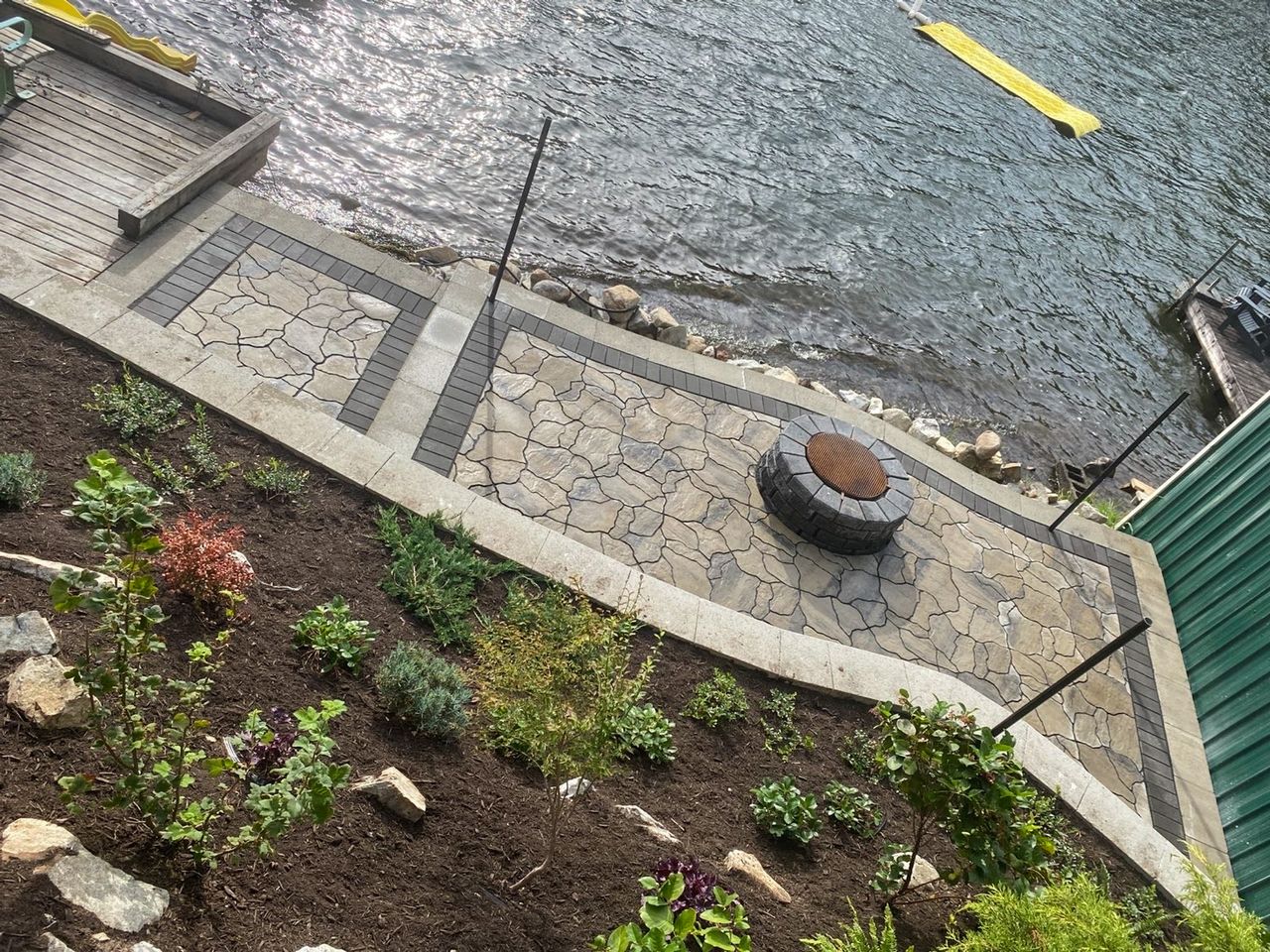 Paver patio with fire pit and garden by Hughes Landscaping, Chilliwack